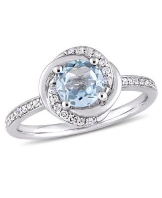 Delmar - Blue Topaz (1 ct. t.w.) and Diamond (1/6 ct. t.w.) Swirl Ring in 10k White Gold